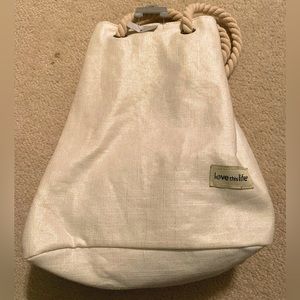 New Love This Life - cream and gold thread satchel. Rope handle drawstring.